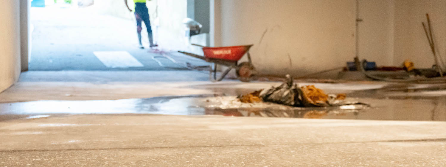 wheel-borrow and worker in a building site