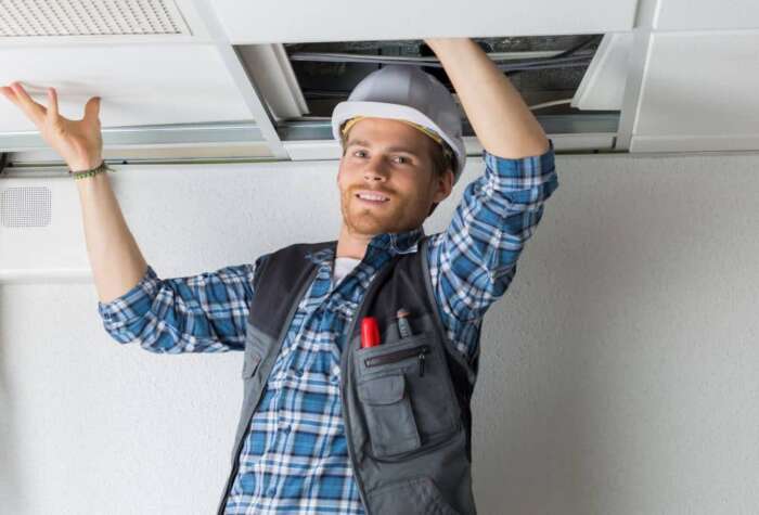 Electrician working on the ceiling.