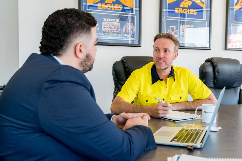business-insurance-statistics All Trades Cover team member talking to a tradie about business insurance statistics