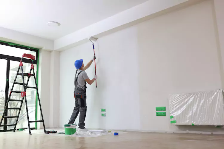 painters-insurance-ceiling Painter using a roller on the ceiling