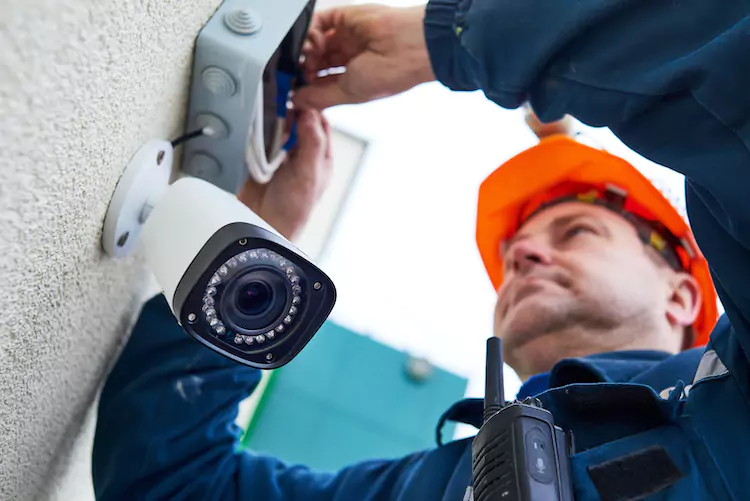 CCTV installer installing a camera
