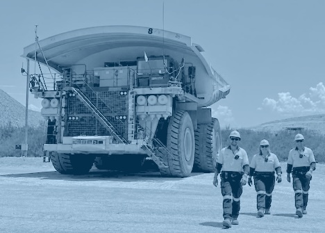 Mining contractors walking away from industrial machinery
